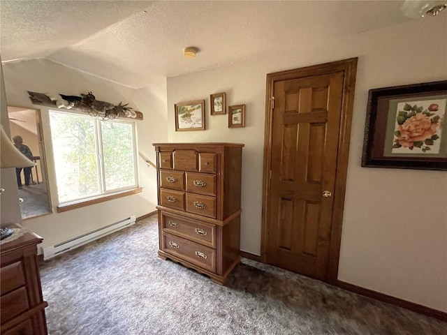 carpeted bedroom with vaulted ceiling, a textured ceiling, and a baseboard radiator