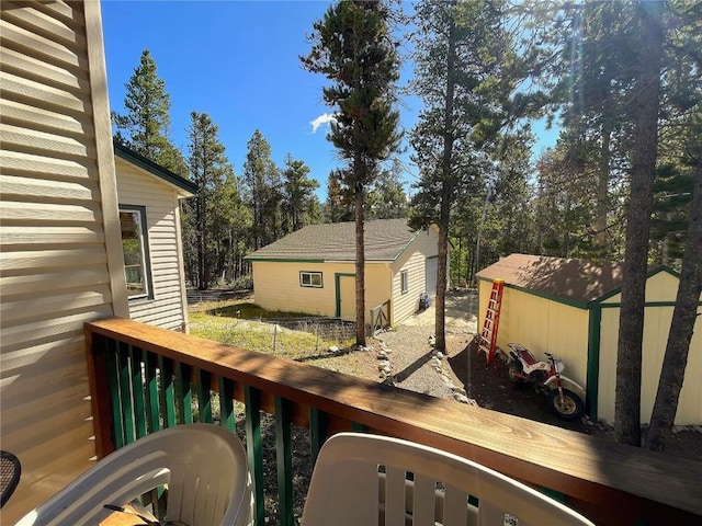 wooden deck featuring a storage unit