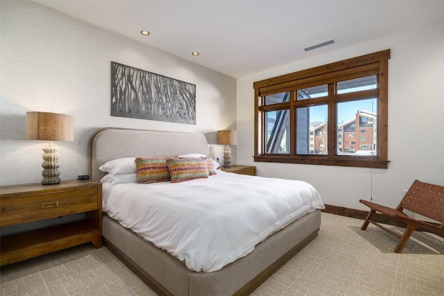 bedroom with light colored carpet