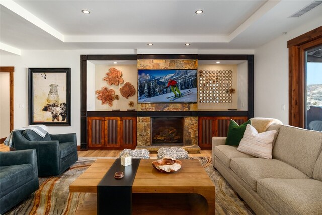 living room with wine cooler, a notable chandelier, bar, and hardwood / wood-style flooring