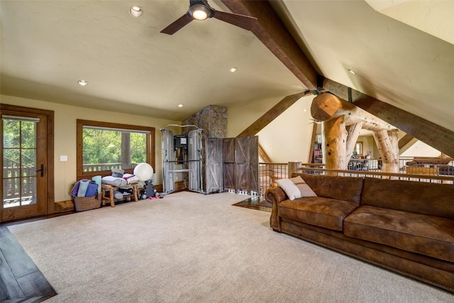 living room featuring lofted ceiling with beams, ceiling fan, and carpet floors