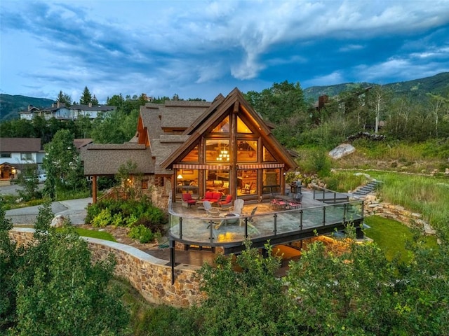 back of house with a mountain view