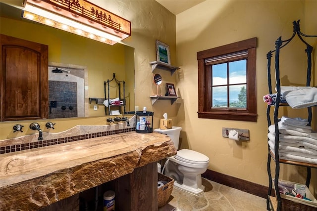 bathroom with tile patterned floors and toilet