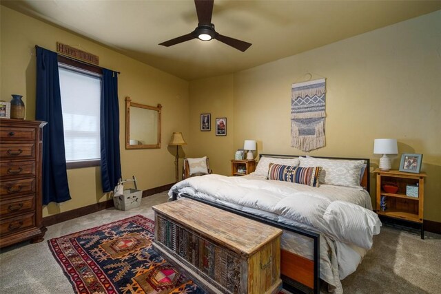 bedroom with ceiling fan and light carpet