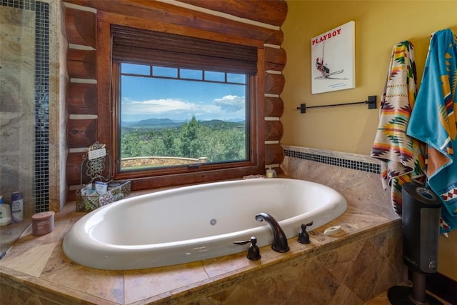 bathroom featuring tiled bath