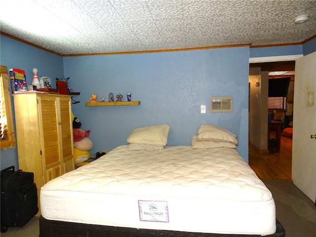 bedroom with hardwood / wood-style flooring and ornamental molding