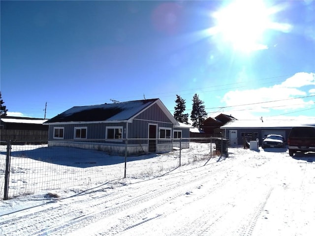 view of snow covered house