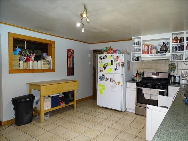 kitchen with gas stove, tasteful backsplash, light tile patterned floors, ornamental molding, and white fridge