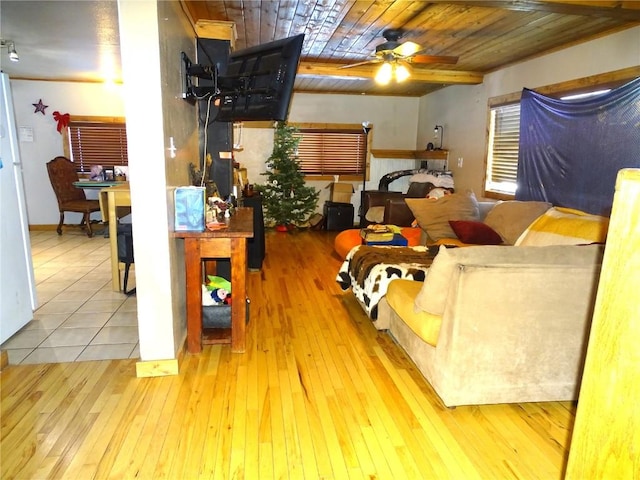 interior space featuring wood ceiling, ceiling fan, and light hardwood / wood-style flooring