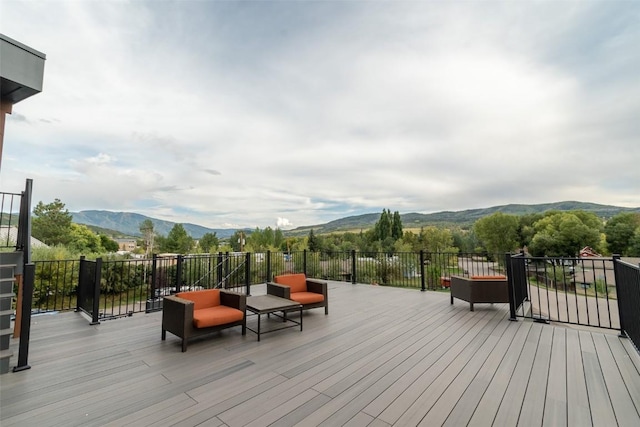 wooden terrace with a mountain view