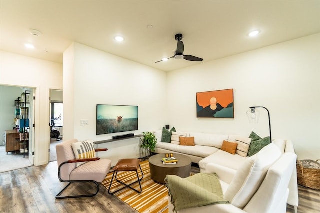 living room with hardwood / wood-style floors and ceiling fan