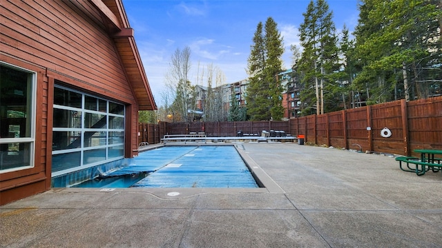 view of swimming pool featuring a patio