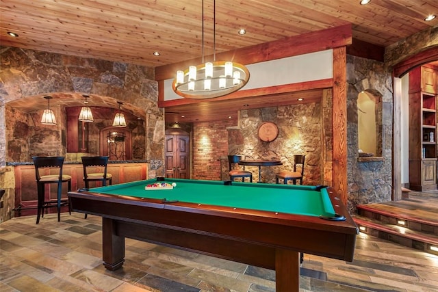 game room with wood ceiling and pool table