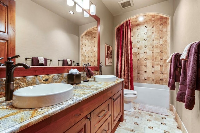 full bathroom with vanity, toilet, and shower / bathtub combination with curtain