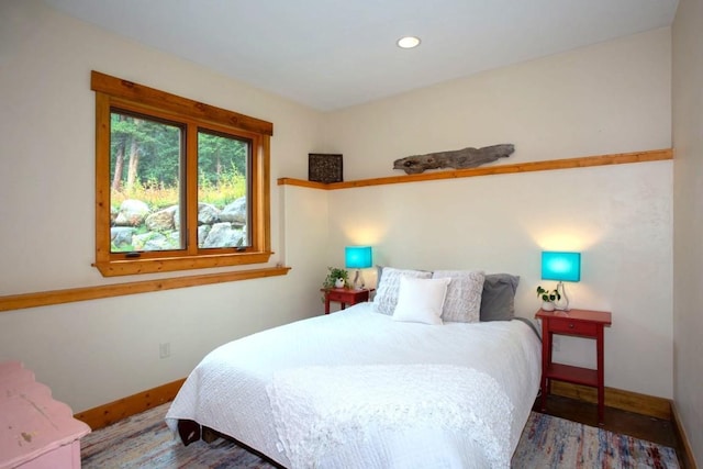 bedroom with hardwood / wood-style floors