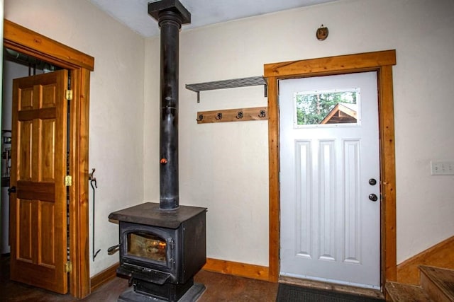 foyer entrance with a wood stove