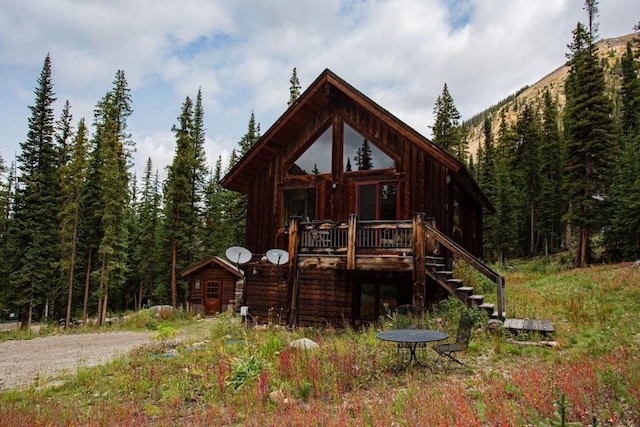 back of property featuring a deck