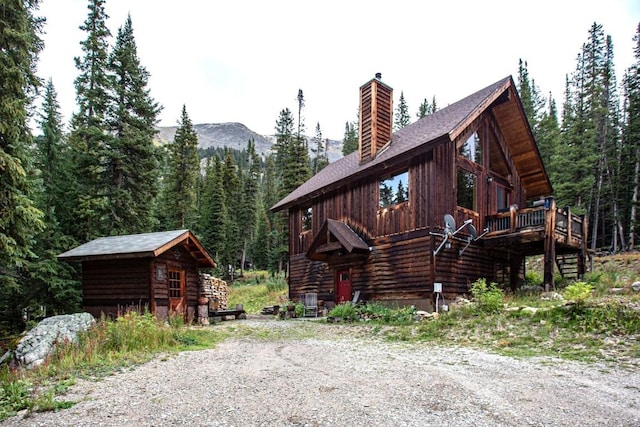 view of property exterior featuring a deck