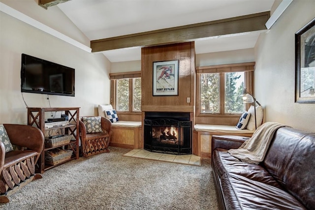 living room featuring lofted ceiling with beams, a fireplace, and light colored carpet