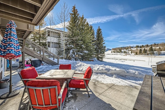 view of snow covered patio