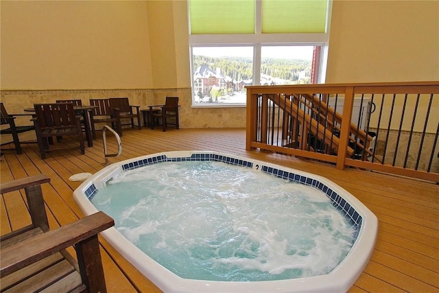 view of pool with an indoor hot tub