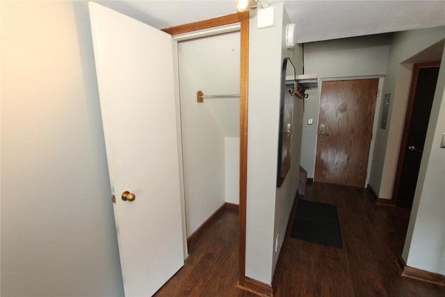 hallway with wood finished floors and baseboards