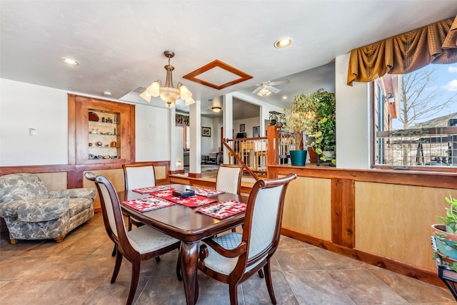 dining area with built in shelves and ceiling fan with notable chandelier