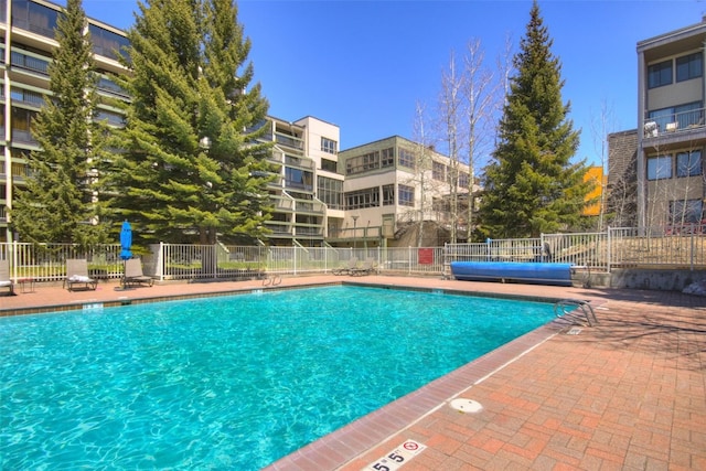 view of swimming pool with a patio