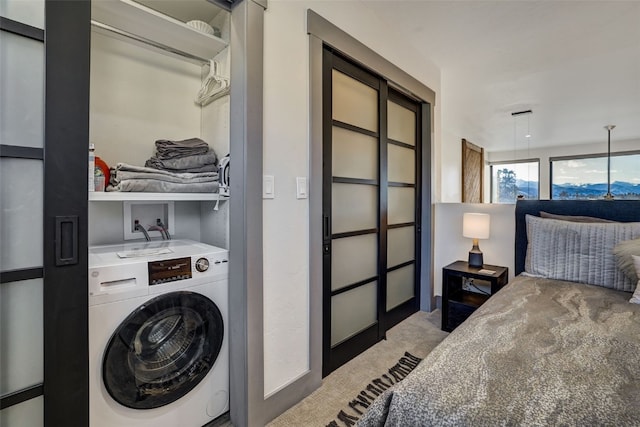 laundry room with washer / clothes dryer and carpet flooring