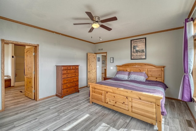 bedroom with ornamental molding, light wood finished floors, visible vents, and baseboards