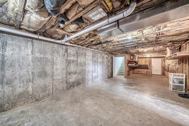 unfinished basement with stairway