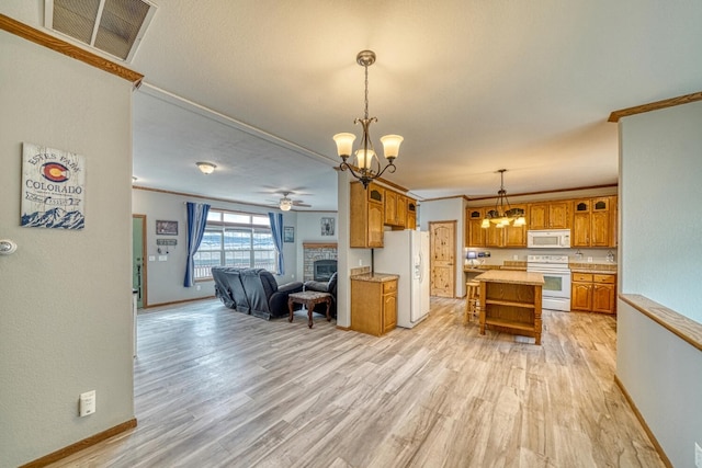 kitchen with white appliances, visible vents, brown cabinets, open floor plan, and light countertops