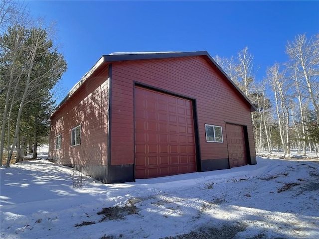 view of snow covered garage