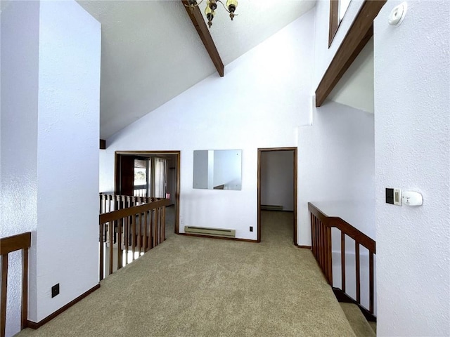 hall with beamed ceiling, light colored carpet, and high vaulted ceiling