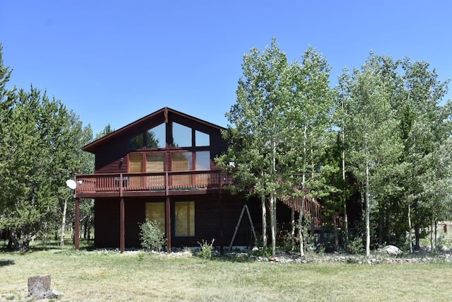 rear view of house with a wooden deck