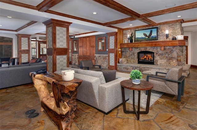 living room featuring a stone fireplace, coffered ceiling, ornamental molding, beam ceiling, and decorative columns