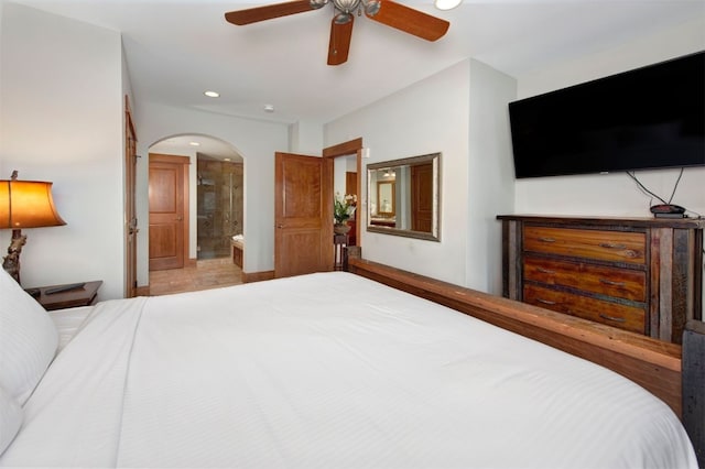 bedroom featuring ceiling fan and ensuite bathroom