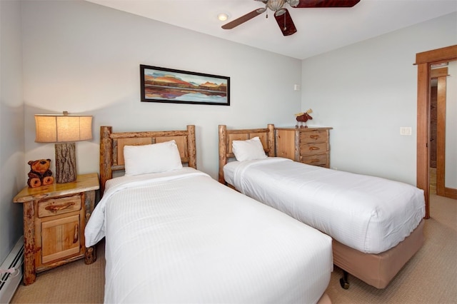 carpeted bedroom featuring ceiling fan and a baseboard radiator