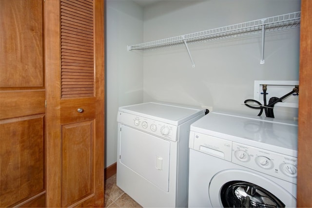 laundry area featuring washing machine and clothes dryer