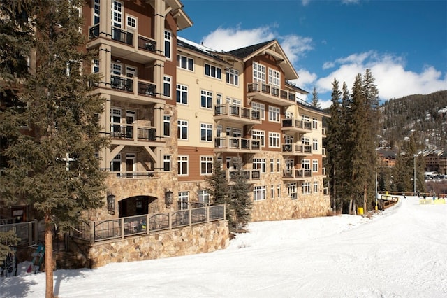 snow covered building with a mountain view