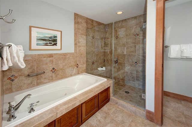 bathroom with tile patterned flooring and independent shower and bath