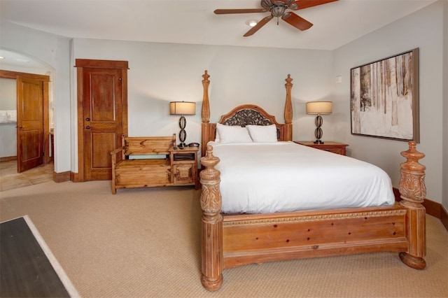 bedroom with ceiling fan and light colored carpet