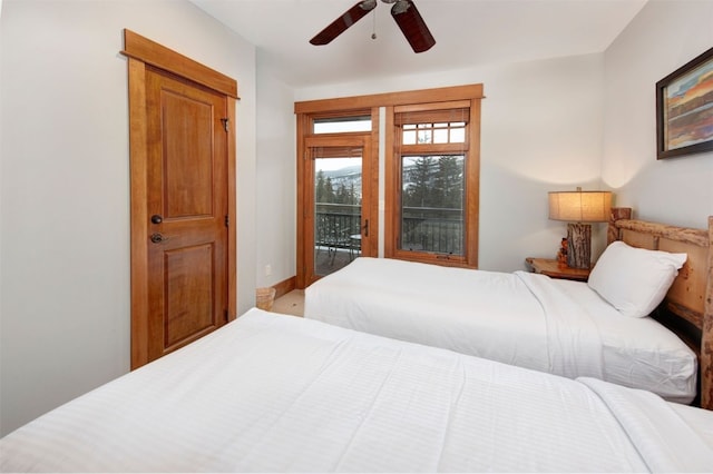 bedroom with access to exterior and ceiling fan