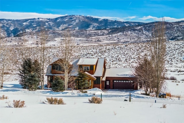 exterior space featuring a mountain view and an attached garage