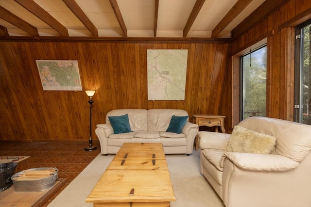 living room featuring beamed ceiling and wooden walls