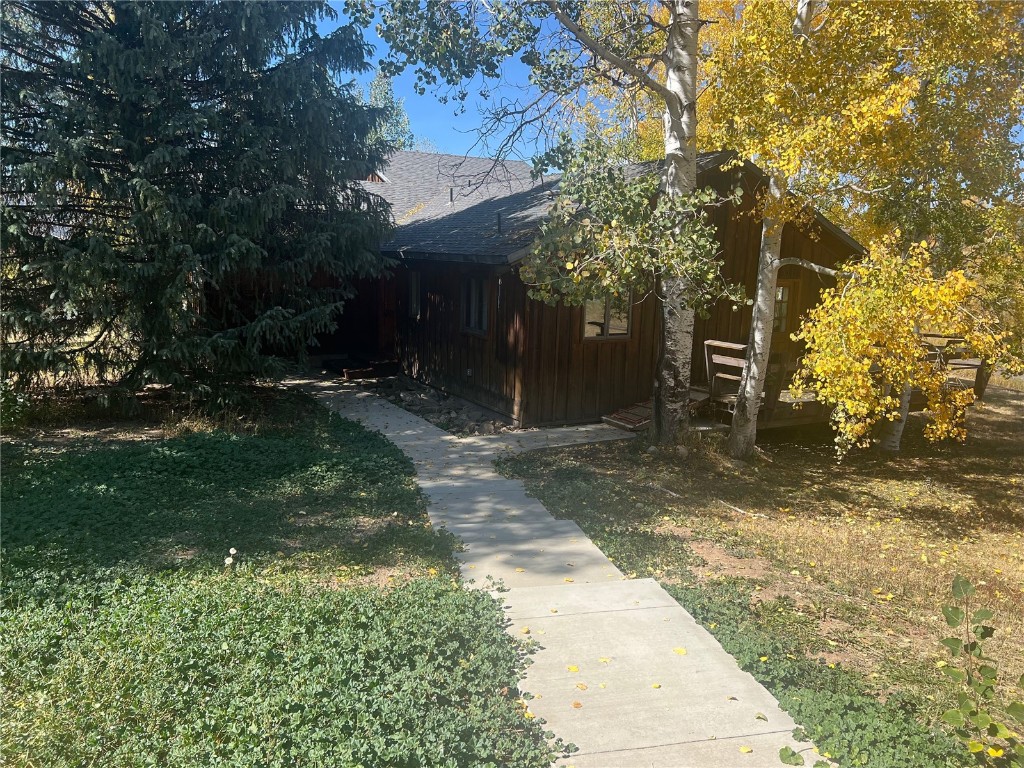 view of home's exterior with a lawn