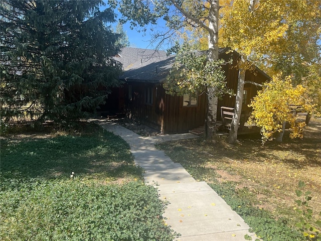 view of home's exterior with a lawn