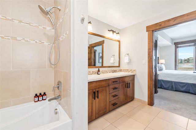 bathroom featuring double vanity, tile patterned floors, a sink, and ensuite bathroom