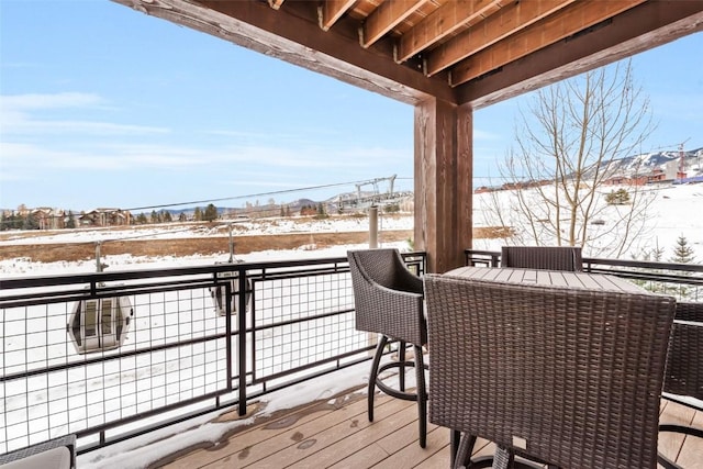 view of snow covered deck