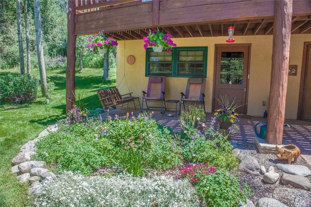 exterior space with a lawn and a porch